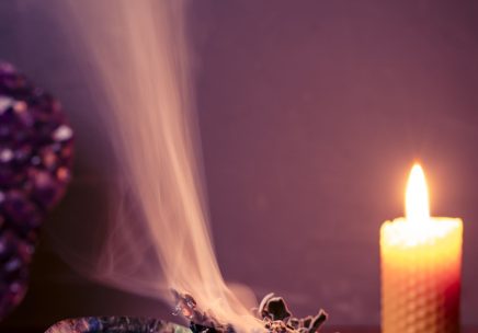 closeup-of-a-burning-sage-smudging-on-purple-light-2023-11-27-05-04-46-utc